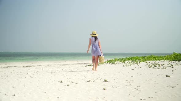 Young Caucasian Woman Reading Book On The Beach