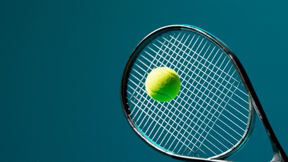 Slow-motion animation of the tennis racket striking the ball. A ball hit. 4 K HD