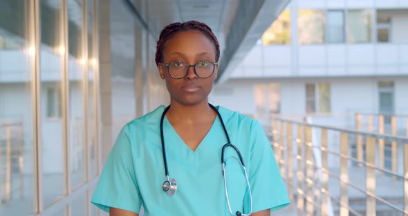 Close Up Portrait of Afroamerican Female Healthcare Worker Standing Outside Hospital