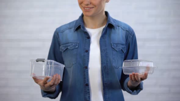 Female Choosing Bioplastic Food Container Instead Non-Disposable Box, Pollution