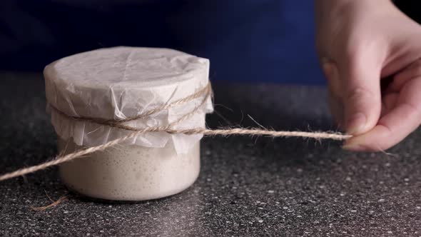 çOpening Wheat Leaven Jar CloseUp