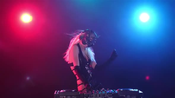 Blonde Longhair Woman Dj in Kitty Mask and Erotic Dress