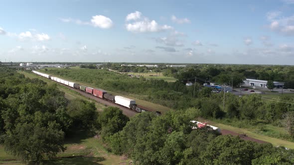 Train traveling down railway towards city in Texas