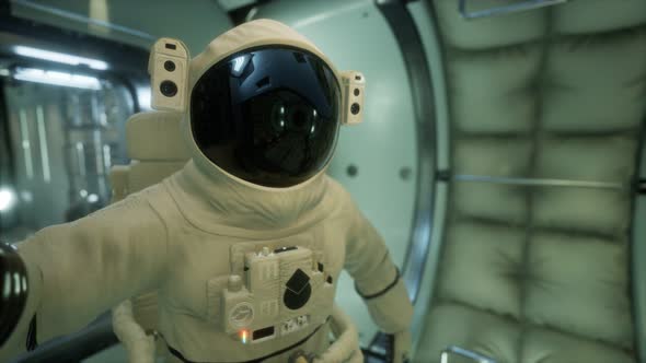Astronaut Inside the Orbital Space Station alt