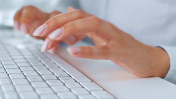 Female Hands Typing on a Computer Keyboard. Concept of Remote Work.