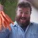 Happy farmer or seller with bunch of fresh carrots - VideoHive Item for Sale