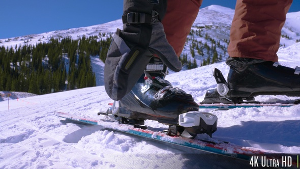 4K Skier Snapping on Ski Boots in Slow Motion