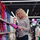 Woman Chooses Towel in Shopping Mall - VideoHive Item for Sale