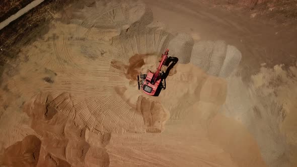 Top View of Excavator Pouring Sand