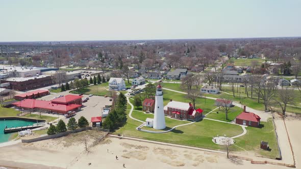 Fort Gratiot Lighthouse in Port Huron, Michigan with drone videoing down.