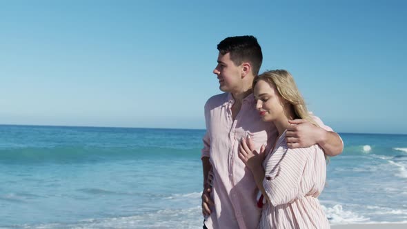 Couple in love enjoying free time on the beach together