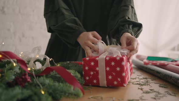 Woman Wrapping Christmas Gifts