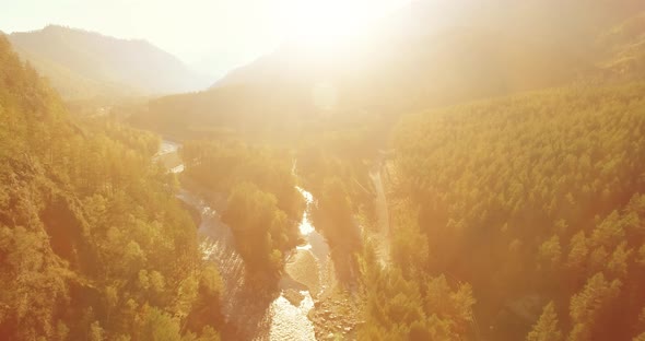 Low Altitude Flight Over Fresh Fast Mountain River with Rocks at Sunny Summer Morning