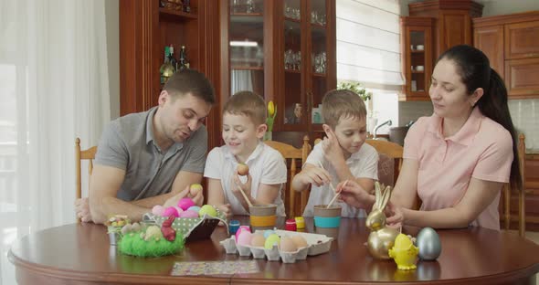 Easter Painting  Family with Two Boys Coloring Easter Eggs