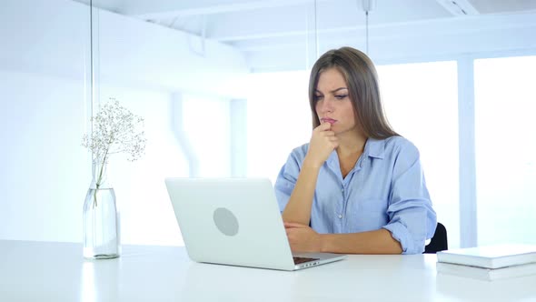 Pensive Woman Working on Laptop, Thinking and Planning