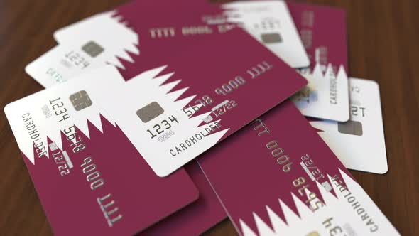 Pile of Credit Cards with Flag of Qatar