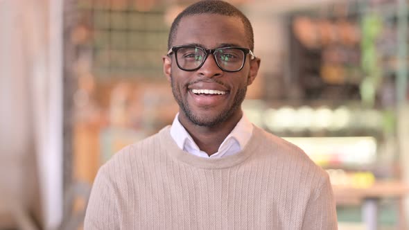 Portrait of Smiling African Man Looking at Camera 