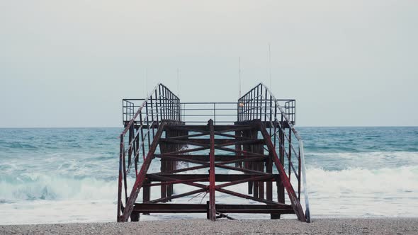 Empty old rusty pier on sea