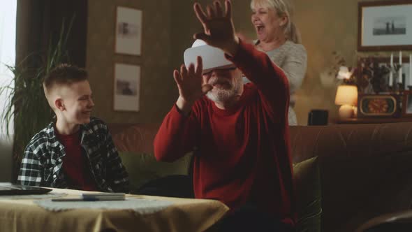 Grandfather in Vitrual Reality Glasses