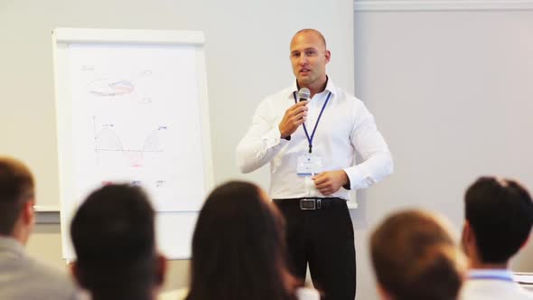 Speaker with Microphone at Business Conference 