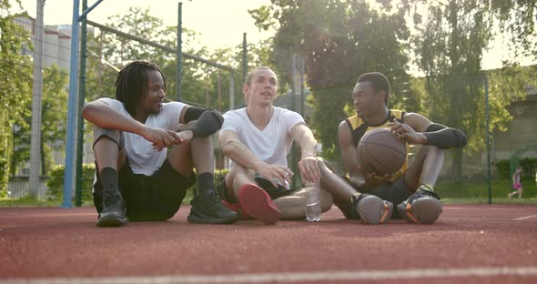 Team of Basketball Players Making a Break