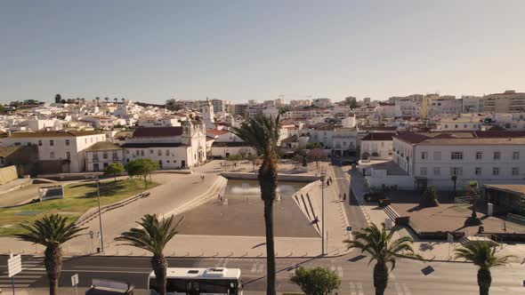 Slowly circling around the town square of Lagos in Portugal while seagulls approach the camera