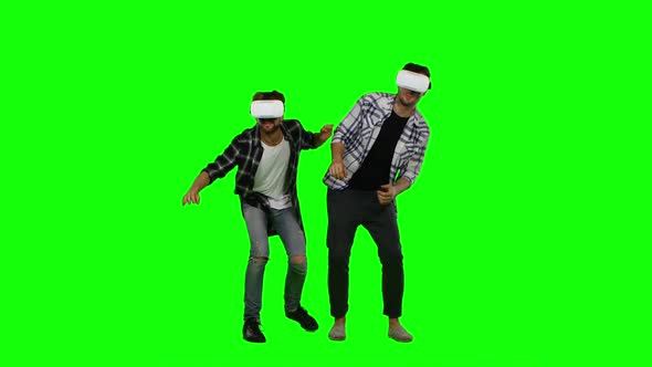 Young Mans Wearing Virtual Reality VR Glasses. Green Screen