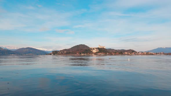 Maggiore Lake with Angera Castle in background. Low angle and static shot