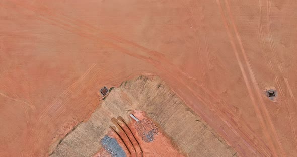 Construction of an Artificial Pond on the Construction Site to Collect Water After Rain Near