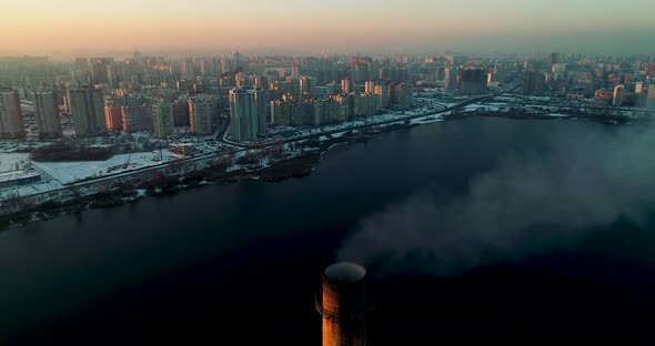 Garbage Incineration Plant in the City at Sunset