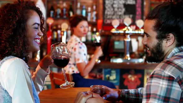 Jealous woman looking at couple flirting with each other