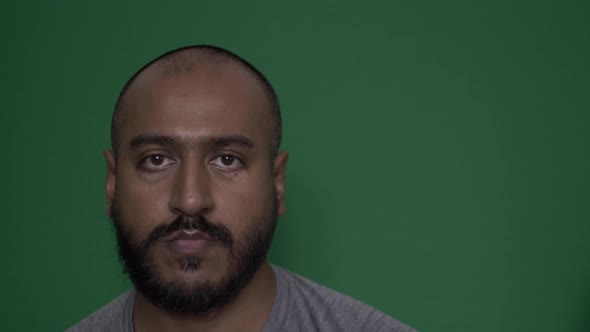 UK Asian Male Looking Directly At Camera, Face Portrait. Green Screen, Locked Off