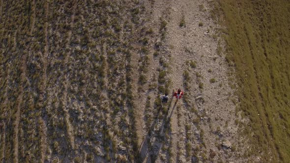 Drone view of two friends hiking in the Apennines, Umbria, Italy