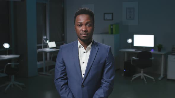 AfricanAmerican Businessman Look at Camera and Speak Giving Presentation in Office