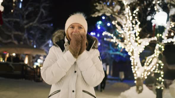 Portrait Smiling Pretty Woman Enjoying Christmas Night and Scenic Illumination