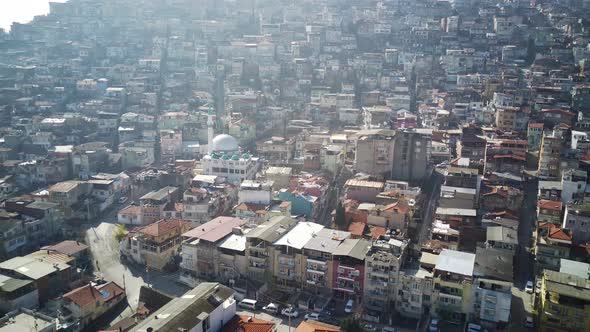 Drone view on poverty slum district and muslim mosque