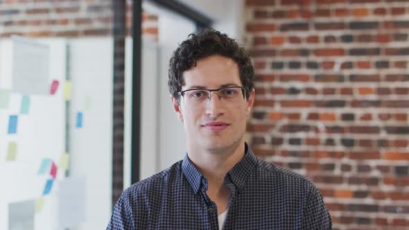 Portrait of man smiling at office