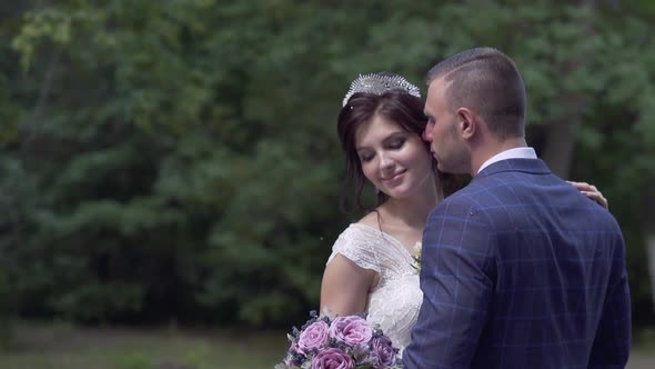 Slow Motion Handsome Fiance Kisses Pretty Bride in Tiara