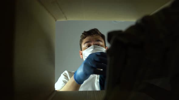 Bottom View Man with Medical Mask and Protective Gloves Against Virus