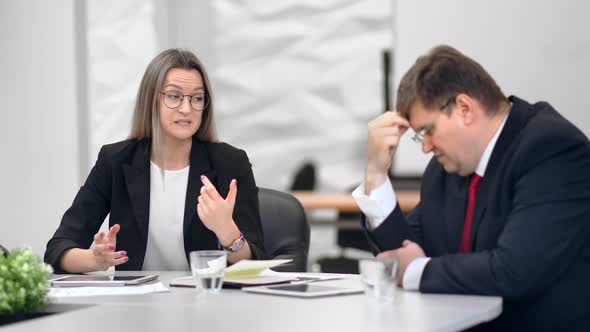 Angry Female Boss Shouting to Male Employee Having Negative Emotion at Office