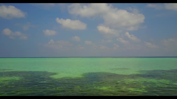 Aerial drone shot tourism of exotic tourist beach holiday by aqua blue lagoon and white sandy backgr