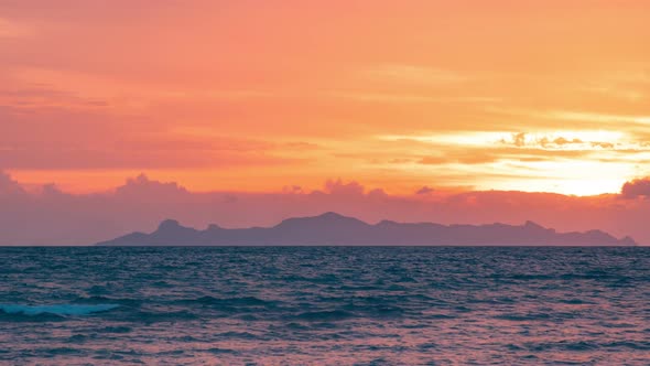 Dramatic sunset over the mountains and the sea of Koh Samui, Thailand