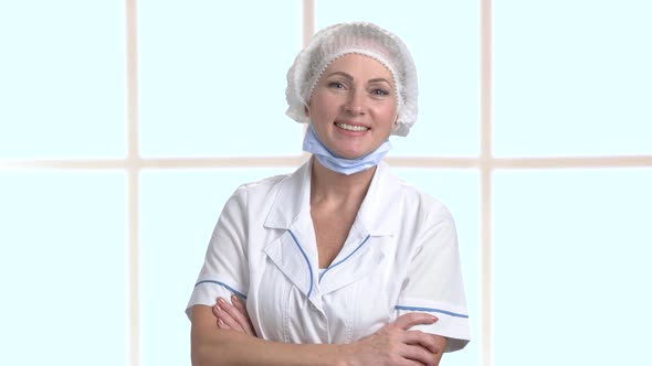 Portrait of Charming Doctor with Arms Crossed.