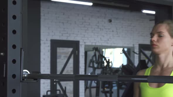 Young Beautiful Sportswoman Resting at the Gym After Exercising