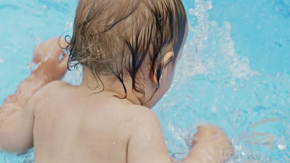 Cute Little Child Bathing in Blue Street Pool in Courtyard. Portrait of Joyful Toddler, Baby. Kid