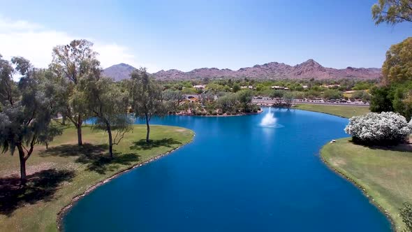 Drone footage fountain at McCormick Ranch, Scottsdale Arizona.  Includes view of a distant Camelback