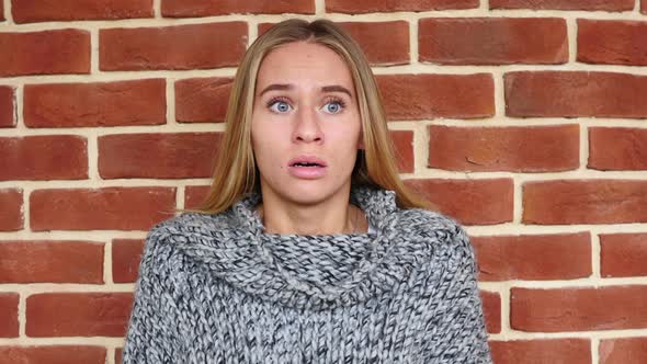 Afraid and Confused Scared Woman in Shock in Loft Office