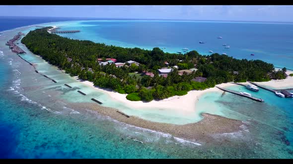 Aerial above nature of beautiful island beach adventure by blue ocean with white sandy background of