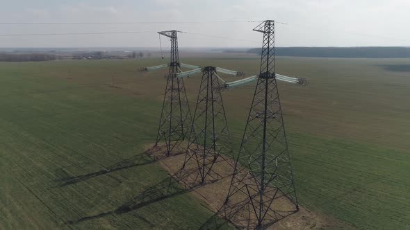 Power Line Industrial View From a Height on the Line of Electric Transmissions in Field Steel Tower