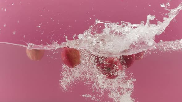 Sweet Apples in Falls Into the Water and Splashes for Design Food Commercial